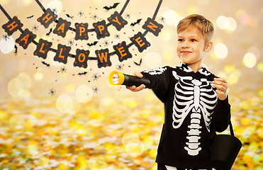 Image showing happy with candies and flashlight on halloween