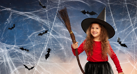 Image showing girl in black witch hat with broom on halloween