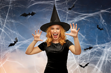 Image showing scary woman in black halloween costume of witch