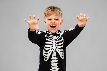 Image showing boy in halloween costume of skeleton making faces