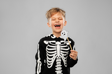 Image showing boy in halloween costume with ghost decoration