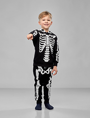 Image showing boy in costume of skeleton pointing to camera