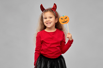 Image showing girl in halloween costume with jack-o-lantern