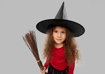 Image showing girl in black witch hat with broom on halloween