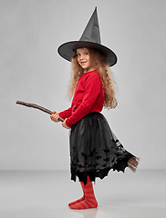 Image showing girl in black witch hat with broom on halloween