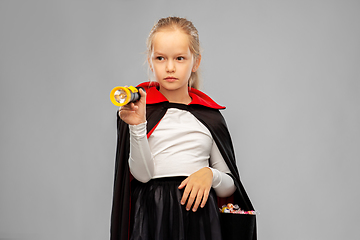 Image showing girl in halloween costume of dracula with candies