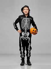 Image showing happy boy in halloween costume with jack-o-lantern