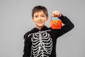 Image showing boy in halloween costume with jack-o-lantern