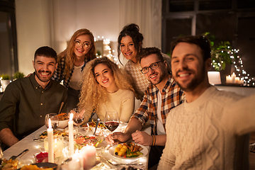 Image showing friends taking selfie at christmas dinner party