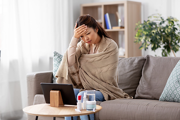 Image showing sick woman having video call on tablet pc at home