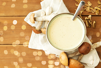 Image showing mushroom cream soup in bowl on cutting board