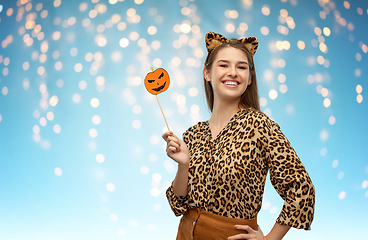 Image showing happy woman in halloween costume of leopard