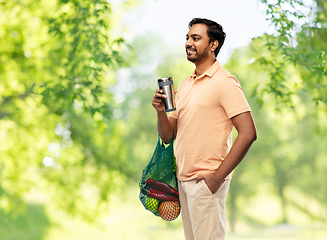 Image showing man with food in bag and tumbler or thermo cup