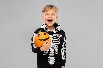 Image showing happy boy in halloween costume with jack-o-lantern