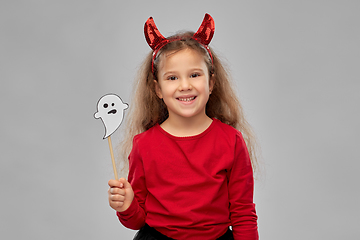 Image showing girl in halloween costume with ghost party prop