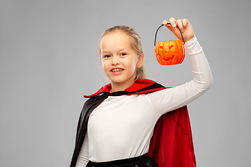 Image showing girl in halloween costume of dracula with pumpkin