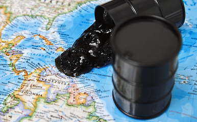 Image showing Oil drums spilling oil to the map