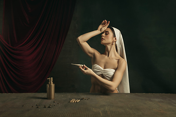 Image showing Modern remake of classical artwork with coronavirus theme - young medieval woman on dark background