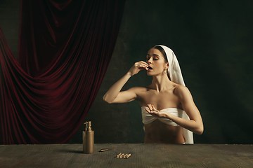 Image showing Modern remake of classical artwork with coronavirus theme - young medieval woman on dark background