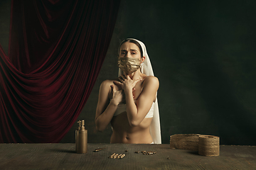 Image showing Modern remake of classical artwork with coronavirus theme - young medieval woman on dark background