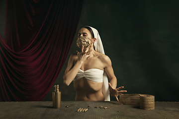 Image showing Modern remake of classical artwork with coronavirus theme - young medieval woman on dark background