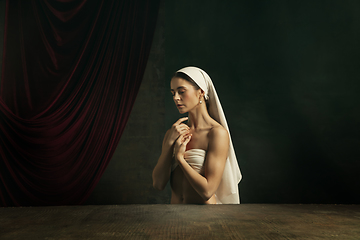 Image showing Modern remake of classical artwork. Young medieval woman on dark background