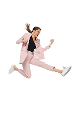 Image showing Happy young woman dancing in stylish clothes or suit, remaking legendary moves of celebrity from culture history