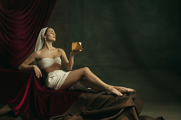 Image showing Modern remake of classical artwork with coronavirus theme - young medieval woman on dark background