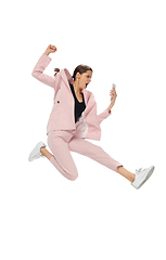 Image showing Happy young woman dancing in stylish clothes or suit, remaking legendary moves of celebrity from culture history