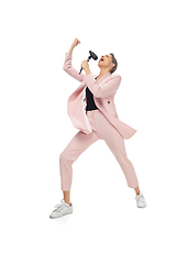 Image showing Happy young woman dancing in stylish clothes or suit, remaking legendary moves of celebrity from culture history