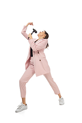 Image showing Happy young woman dancing in stylish clothes or suit, remaking legendary moves of celebrity from culture history