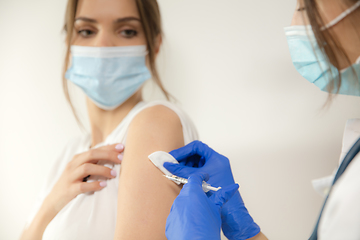 Image showing Close up doctor or nurse giving vaccine to patient using the syringe injected in hospital