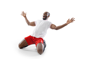 Image showing Funny emotions of professional football, soccer player isolated on white studio background, excitement in game