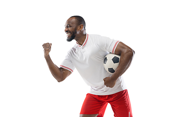 Image showing Funny emotions of professional football, soccer player isolated on white studio background, excitement in game