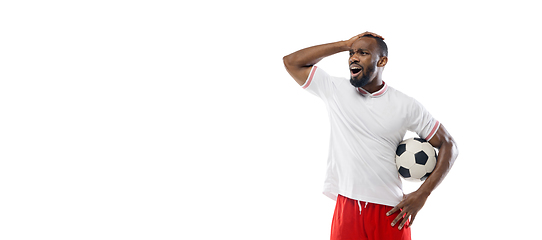 Image showing Funny emotions of professional football, soccer player isolated on white studio background, excitement in game