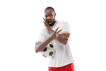 Image showing Funny emotions of professional football, soccer player isolated on white studio background, excitement in game