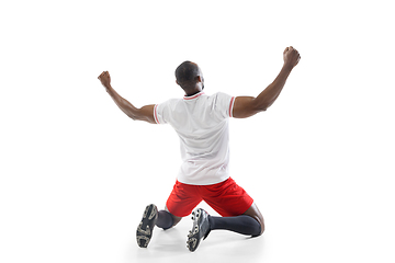 Image showing Funny emotions of professional football, soccer player isolated on white studio background, excitement in game