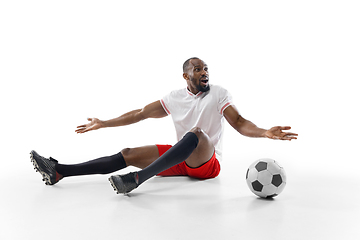 Image showing Funny emotions of professional football, soccer player isolated on white studio background, excitement in game