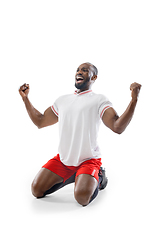 Image showing Funny emotions of professional football, soccer player isolated on white studio background, excitement in game