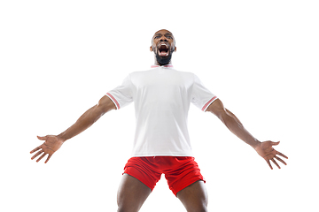 Image showing Funny emotions of professional football, soccer player isolated on white studio background, excitement in game