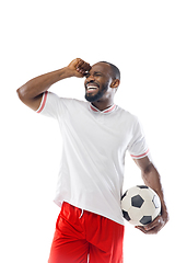 Image showing Funny emotions of professional football, soccer player isolated on white studio background, excitement in game