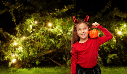 Image showing girl in halloween costume with jack-o-lantern