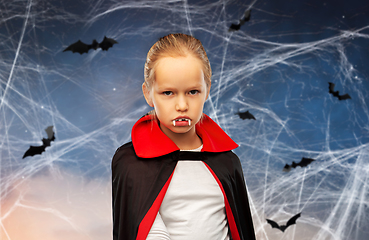 Image showing girl in dracula costume with cape on halloween