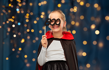 Image showing girl in costume of dracula with cape on halloween