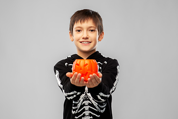 Image showing boy in halloween costume with jack-o-lantern