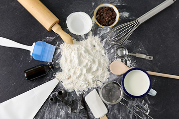 Image showing flour with baking and cooking ingredients on table