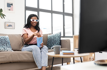 Image showing happy african american woman watching tv at home