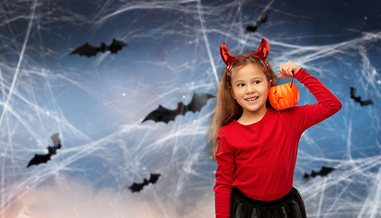 Image showing girl in halloween costume with jack-o-lantern