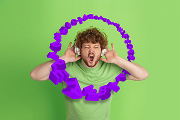 Image showing Man shouting, screaming on studio background. Sales, offer, business, cheering fun concept.