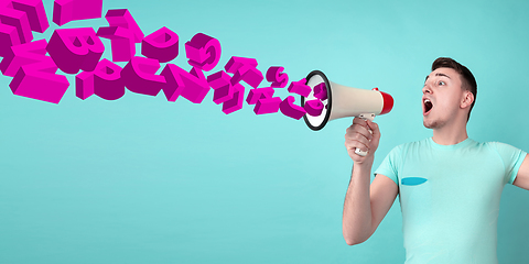 Image showing Man shouting with megaphone, loudspeaker on studio background. Sales, offer, business, cheering fun concept.